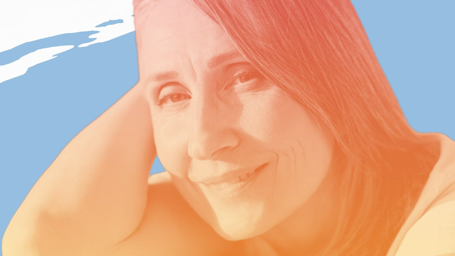 Smiling woman with dark hair resting her head on her arm, for the BelleSkin article Best Face Moisturizer for Dry Skin in Canada: The 6 People Repurchase
