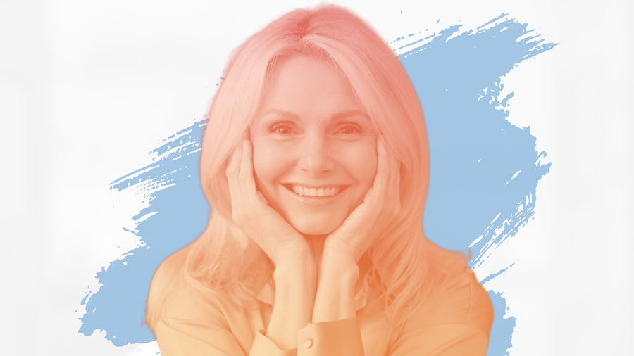 Smiling blonde woman resting her face in her hands, for the BelleSkin article RoC Retinol Correxion vs Medical-Grade Retinol: Worth the Upgrade?